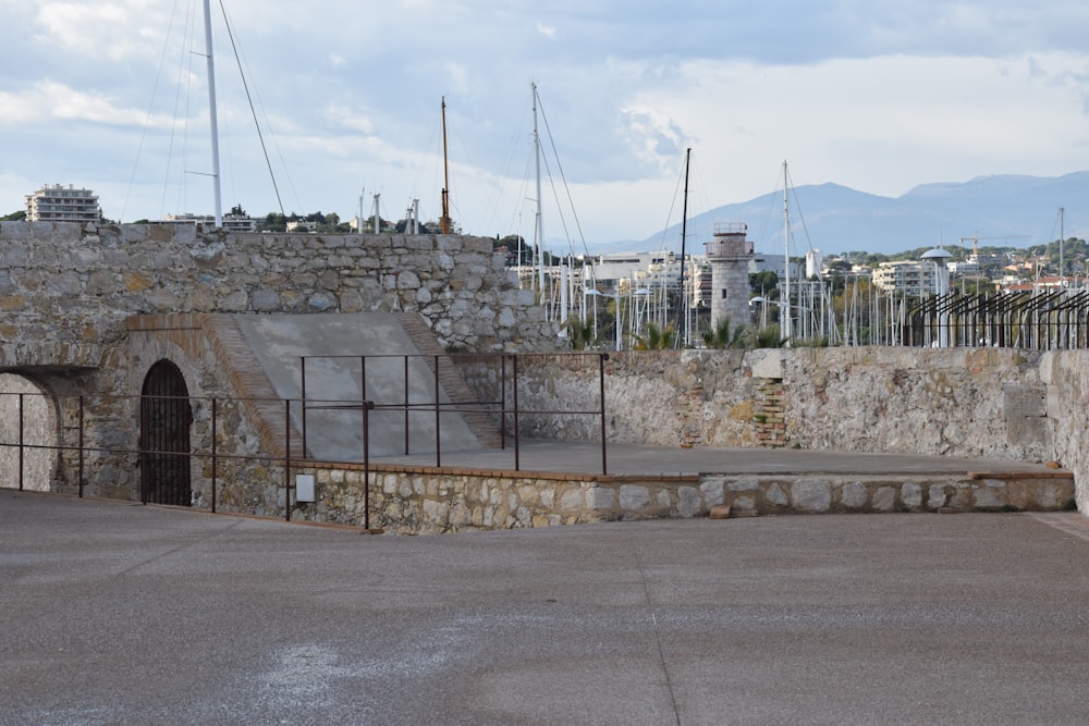 a stone building with a gate in front of it