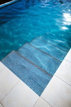 A family enjoying a clean and inviting swimming pool.