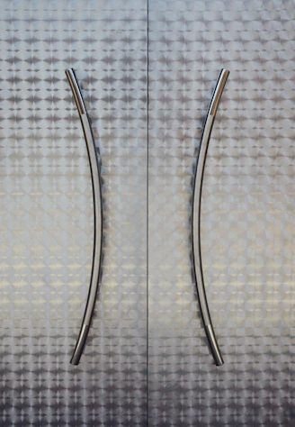 Close-up of sleek cabinet handles in a modern kitchen setting