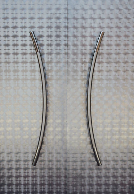 Close-up of sleek cabinet handles in a modern kitchen setting