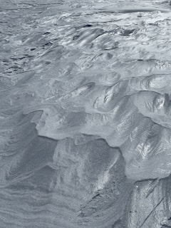 Fine silica sand grains captured under magnification highlighting their texture.