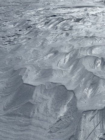 Fine silica sand grains captured under magnification highlighting their texture.