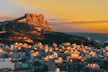 a view of a city with a mountain in the background