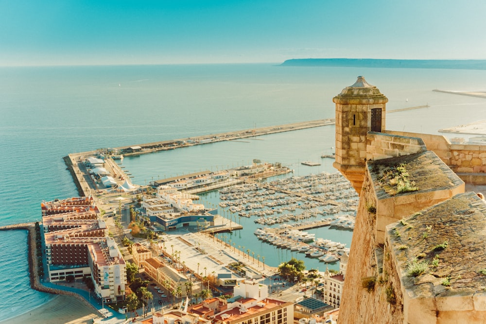 an aerial view of a harbor with boats in the water