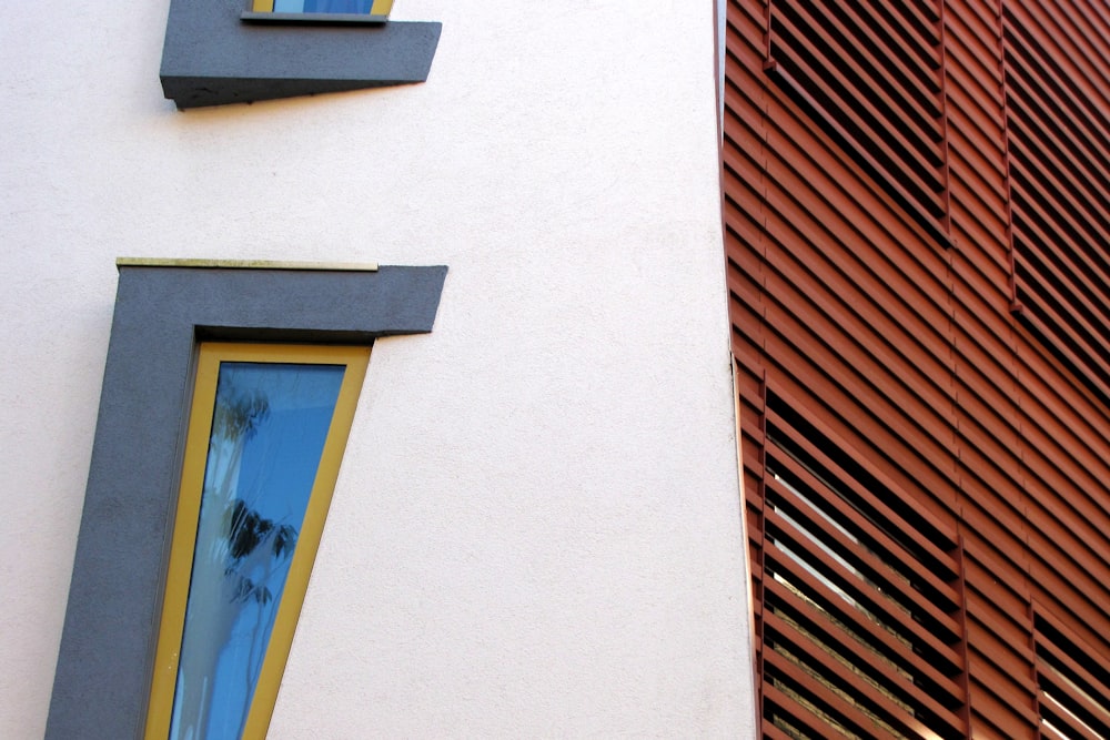 a close up of two windows on a building