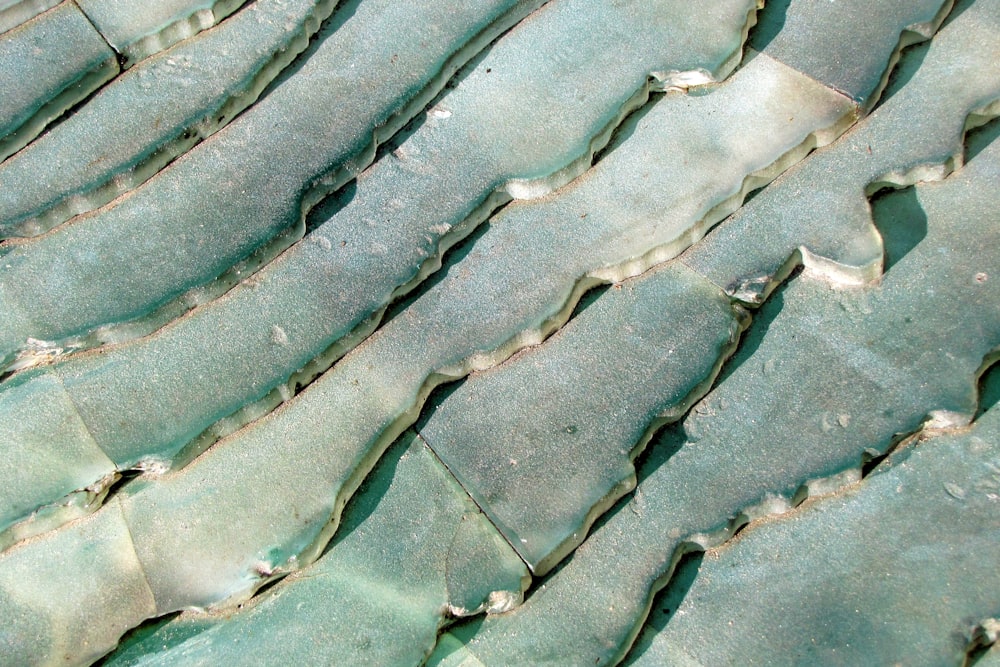 a close up of a piece of green tile