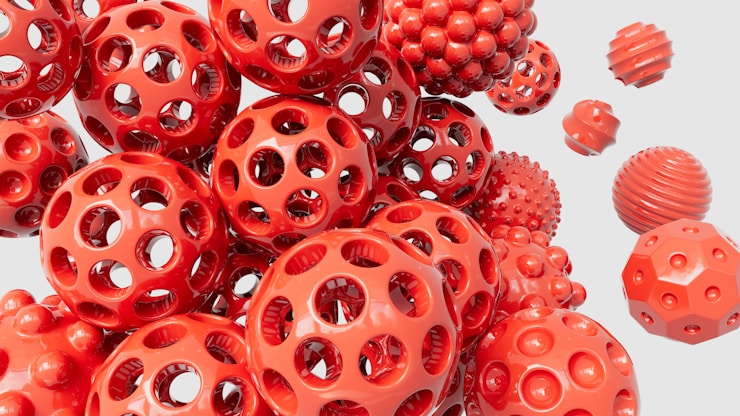 Glossy red spheres in space - Abstract