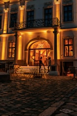 An elegant veranda with decorative wrought iron details and soft lighting.