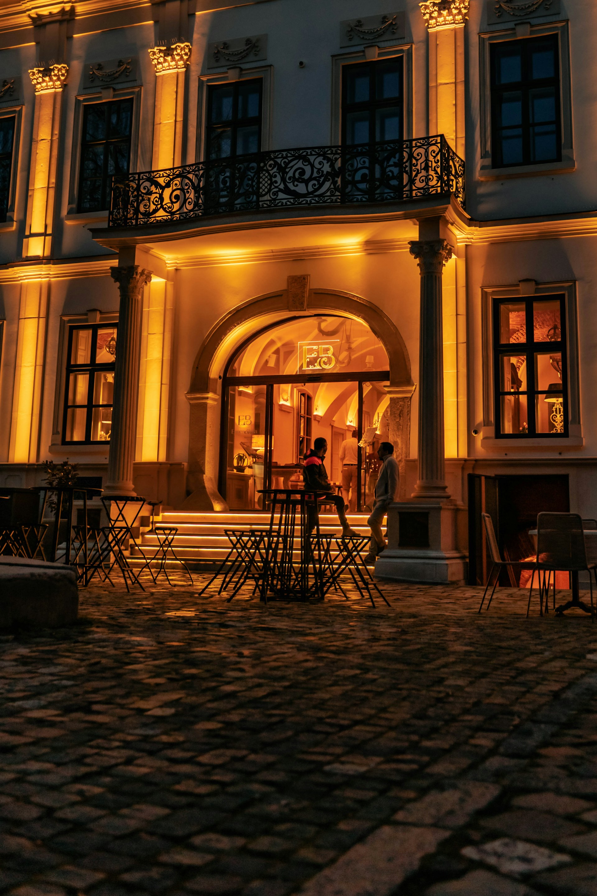 woman wearing yellow long-sleeved dress under white clouds and blue sky during daytime