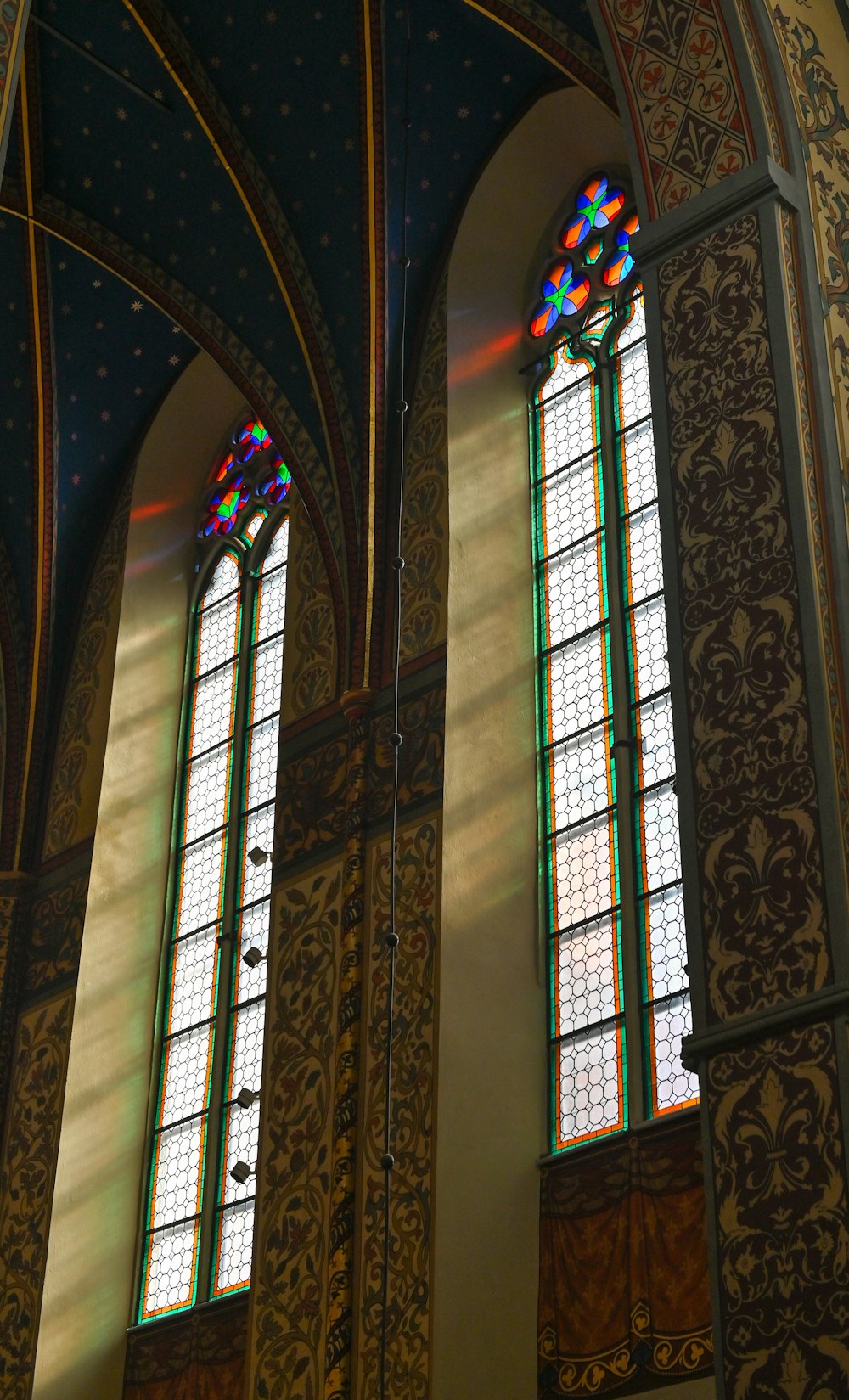 two large stained glass windows in a building