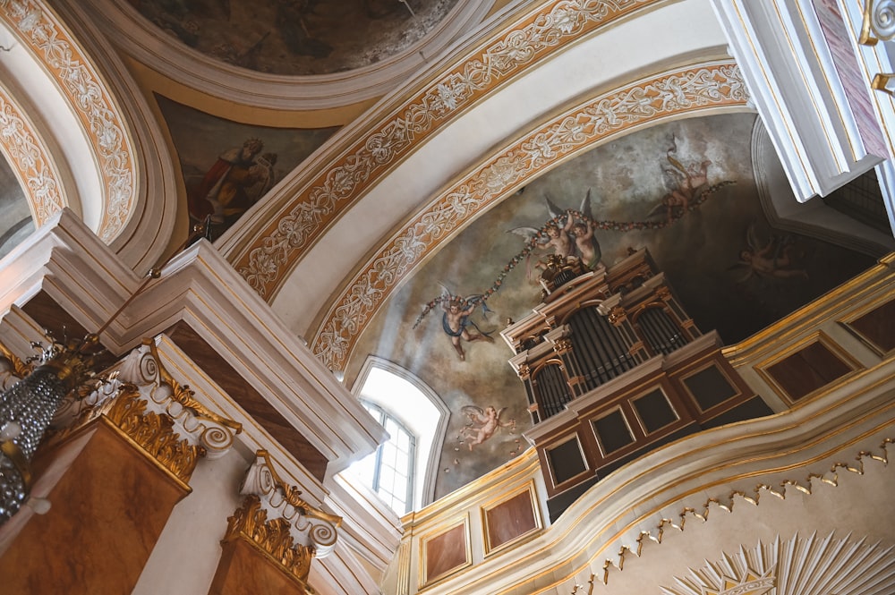 the ceiling of a church with a painting on it