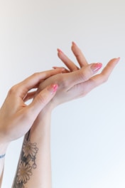two hands reaching up towards each other