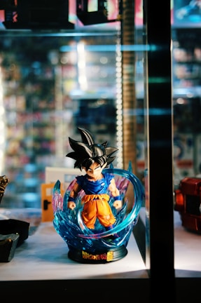 Iconic Dragon Ball battle with Goku powering up in intense energy glow.