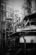 a black and white photo of a building under construction
