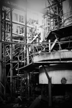 a black and white photo of a building under construction