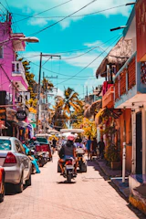A vibrant street scene in Manus Province showing locals engaging in daily activities under bright tropical skies.