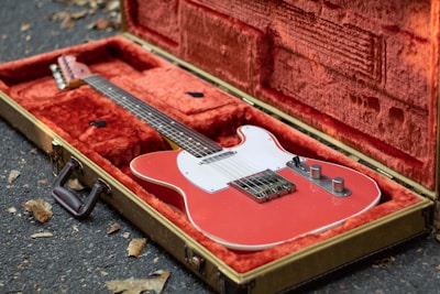 Hardcase with foam interior designed for a vintage guitar, displayed in a workshop
