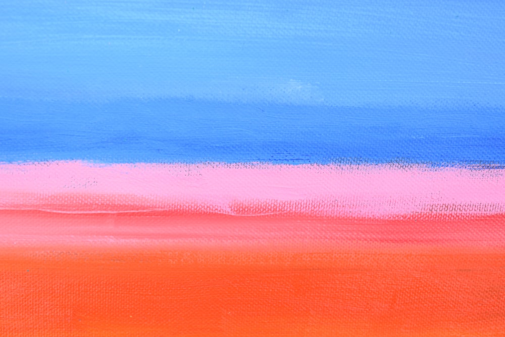 a painting of an orange, blue, and pink horizon