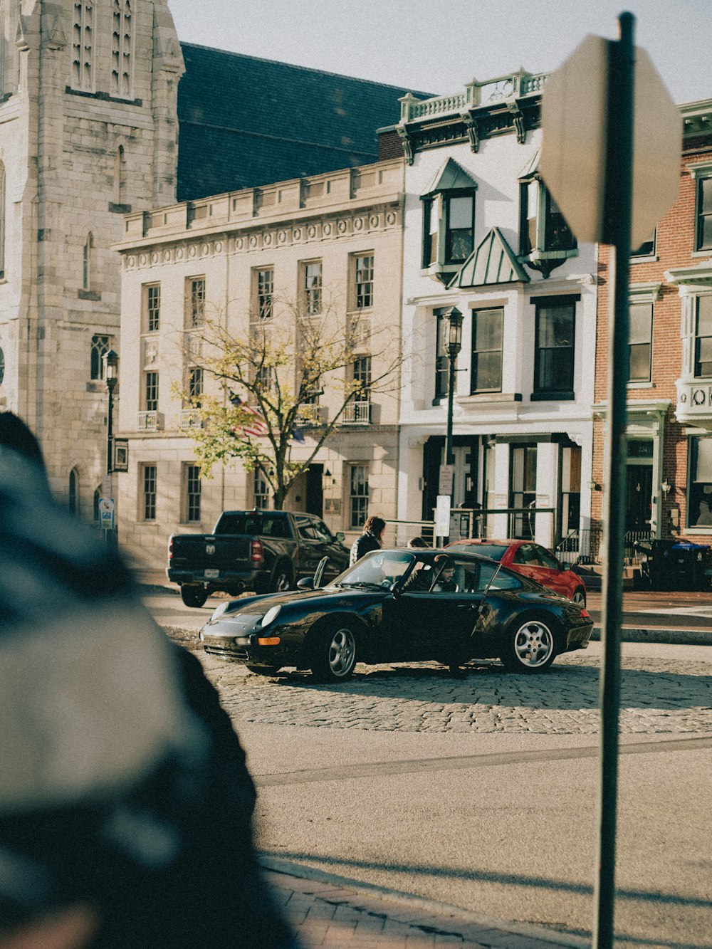 a couple of cars that are parked in the street