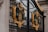 An ornate wrought iron gate adorned with intricate golden embellishments featuring lions, crowns, and emblems. The craftsmanship is detailed, with black metal bars and decorative gold accents creating a regal and majestic appearance.