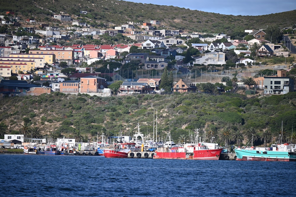 a group of boats floating on top of a body of water