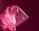 A translucent pink plastic bag with a crinkled texture, contrasting against a deep, maroon background. The lighting highlights the shiny surface and folds of the plastic, creating a dynamic play of light and shadow.