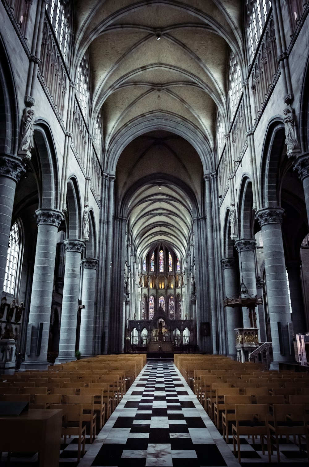 a church with a checkered floor and pews