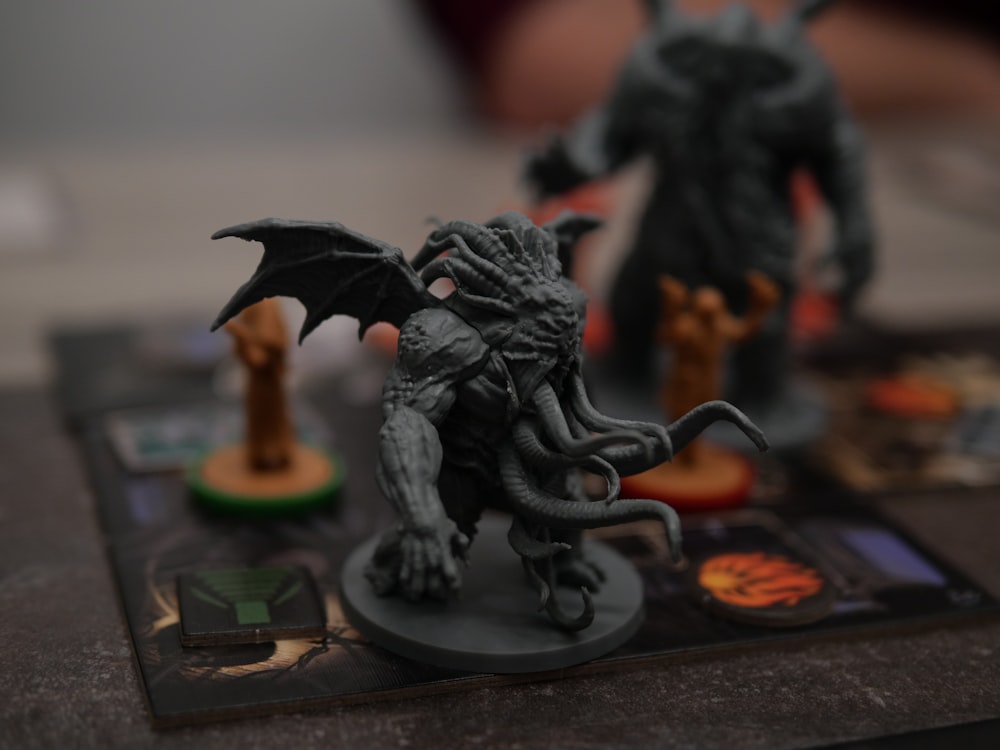 a close up of a dragon figurine on a board game