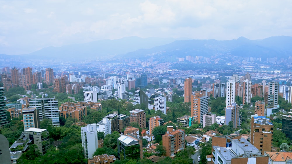 a view of a city with mountains in the background