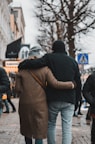 a couple of people walking down a street