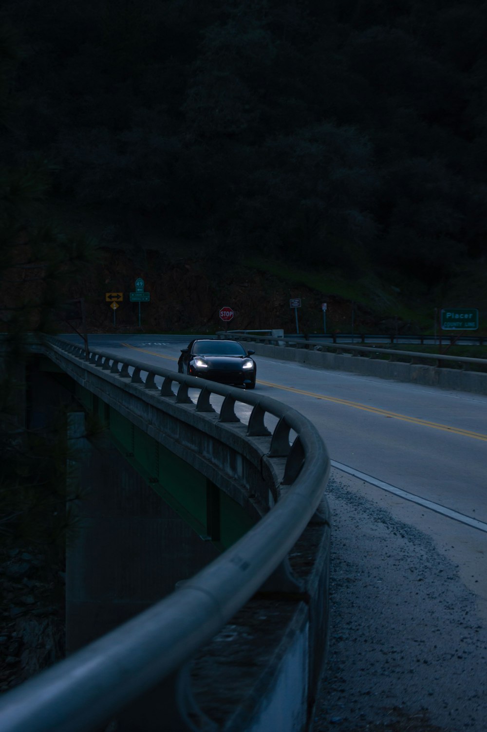 a car driving on a highway at night