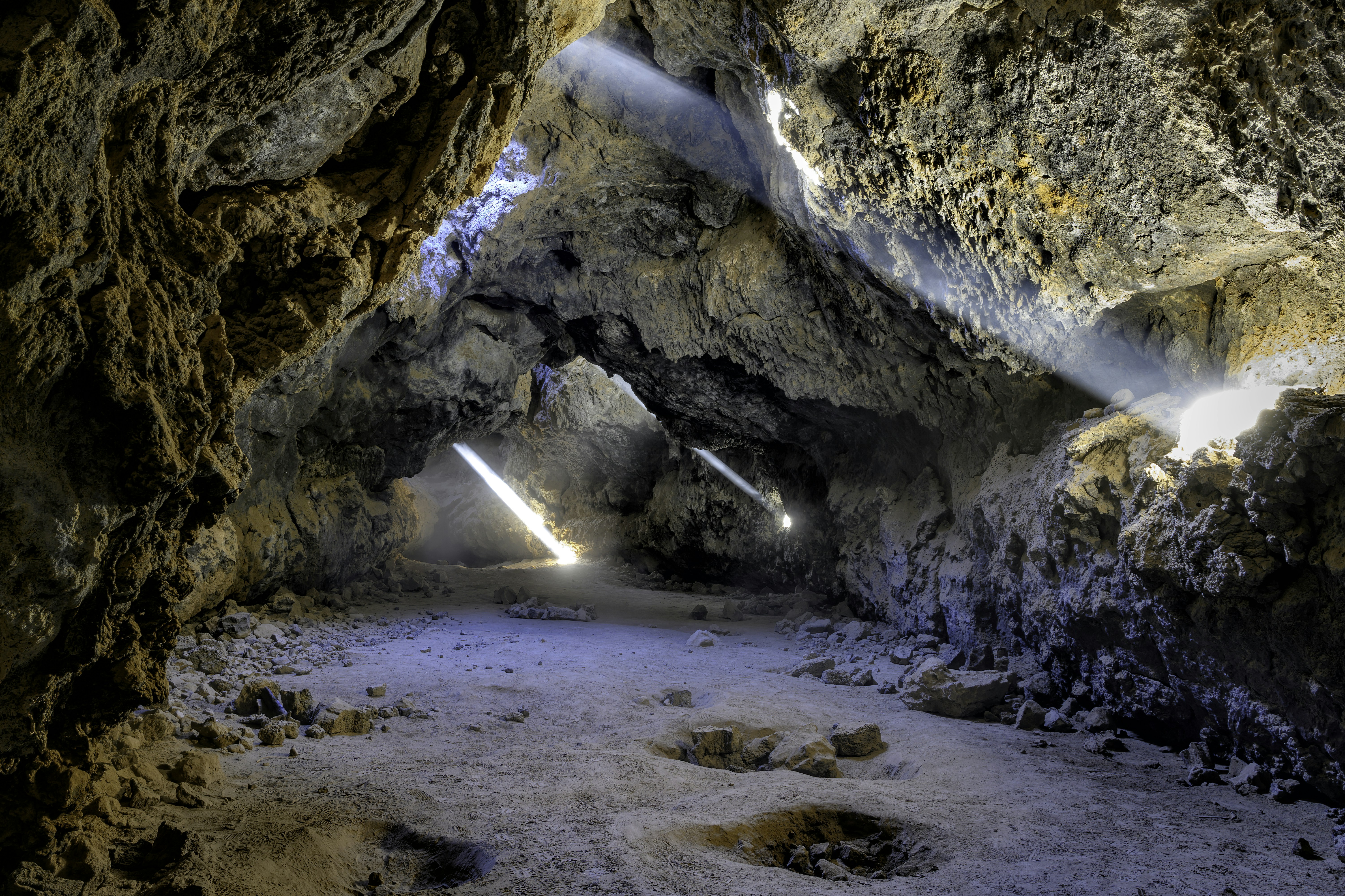 a cave filled with lots of light coming from it