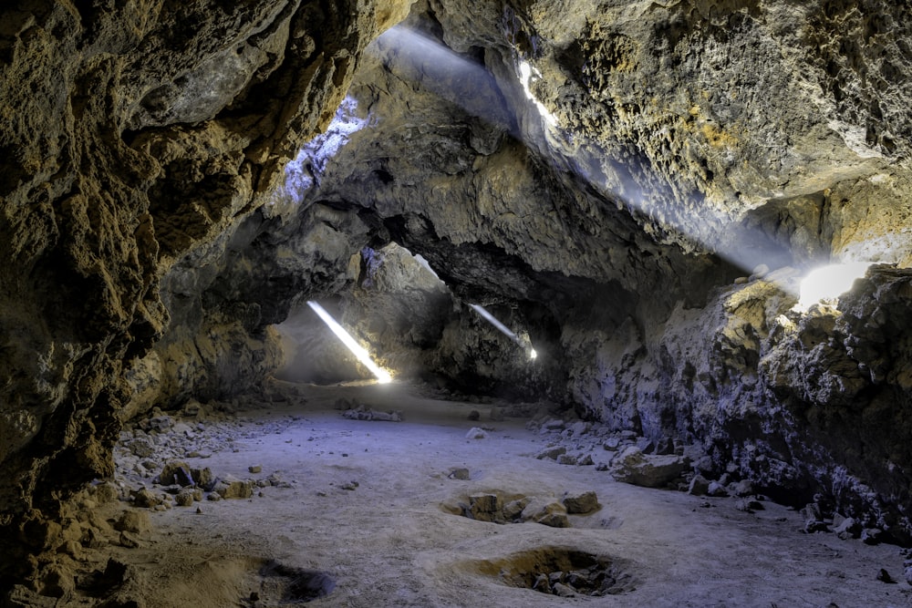 a cave filled with lots of light coming from it