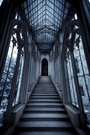 a set of stairs leading up to a large window