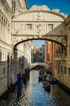 The iconic canals of Venice with gondolas gliding under historic bridges