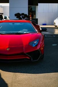 A sleek rental car parked outside the automeister garage on a sunny day
