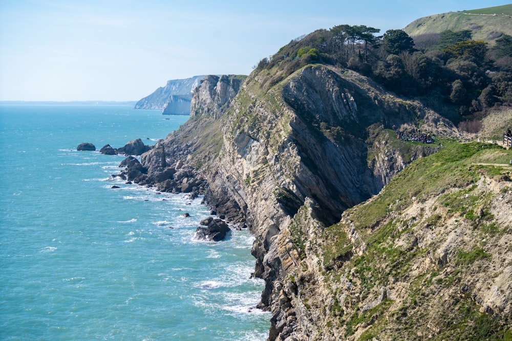 a scenic view of the ocean and cliffs