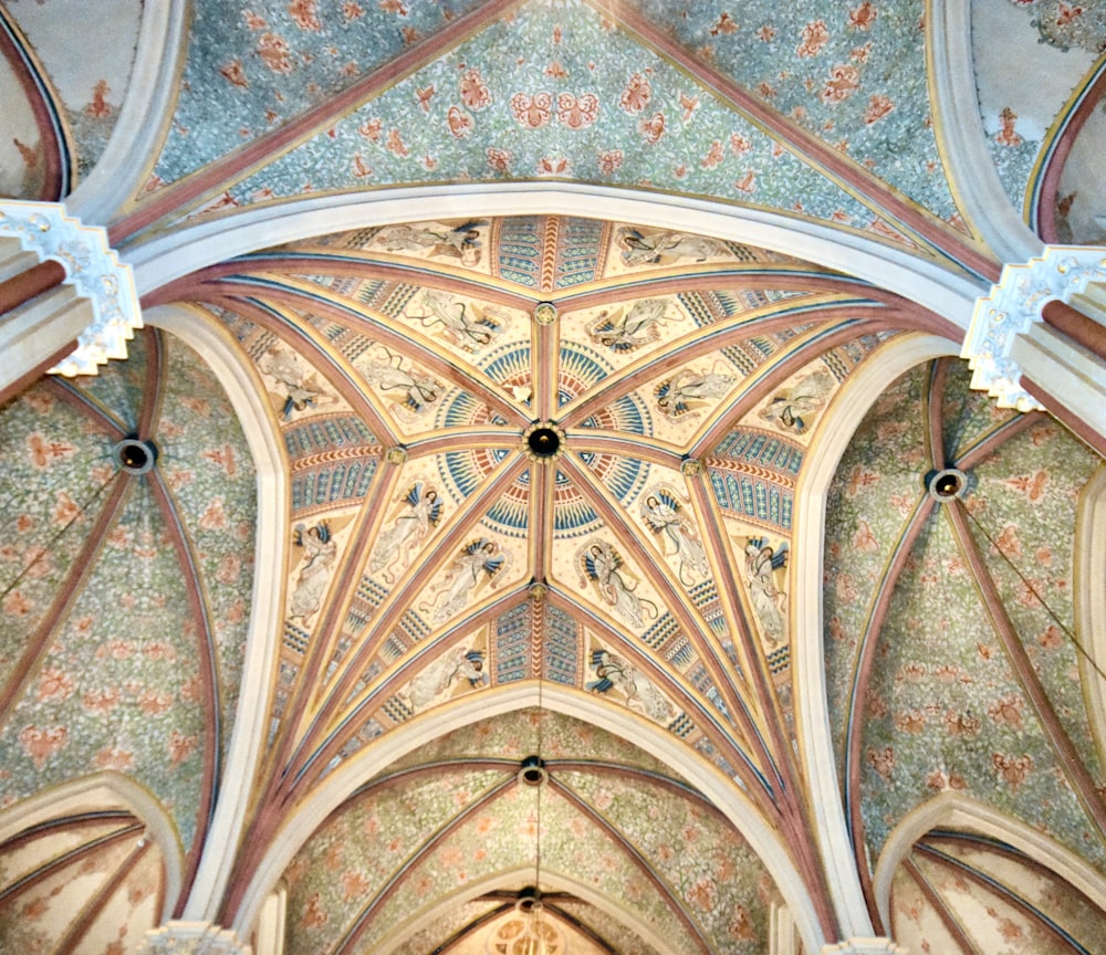the ceiling of a large cathedral with intricate designs