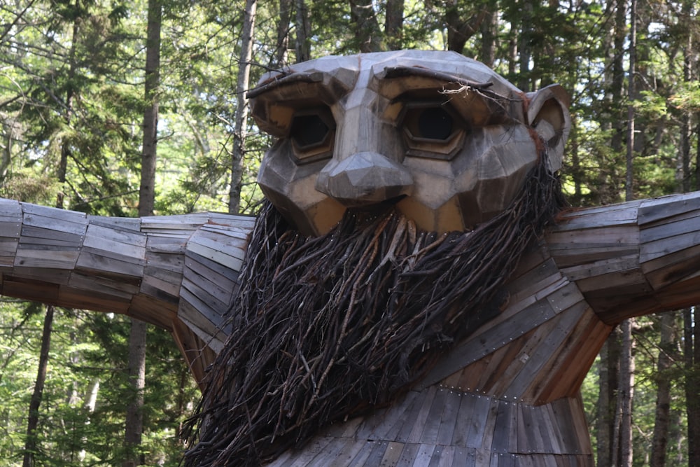 a wooden statue of a man with a beard