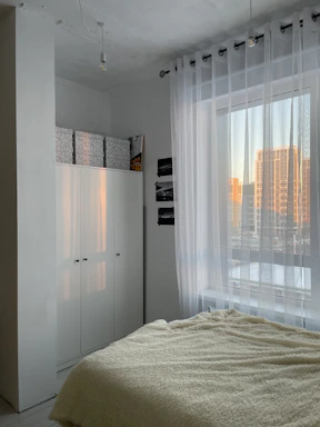 Cozy bedroom with soft natural light and minimalist decor