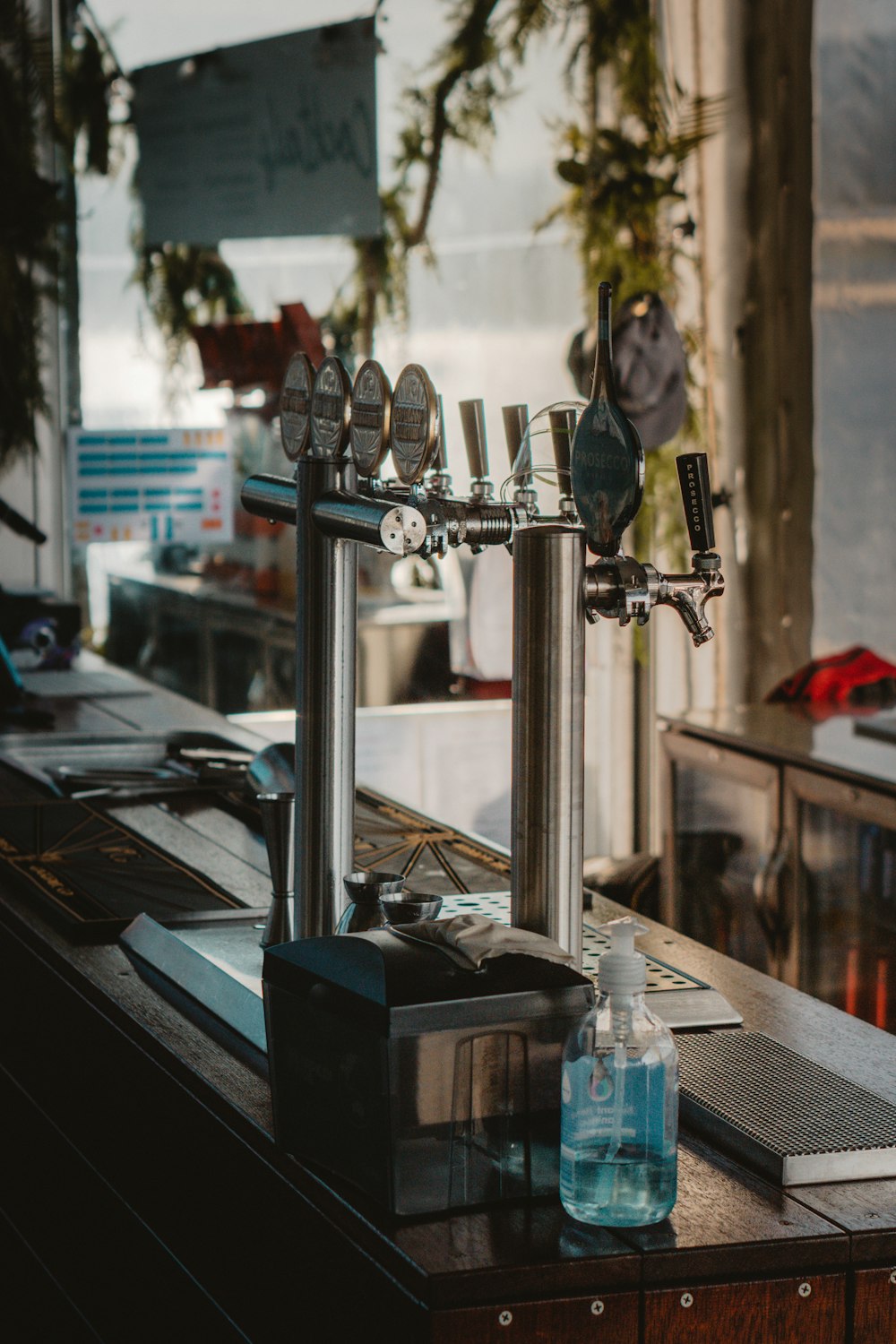 a kitchen counter with a lot of utensils on top of it