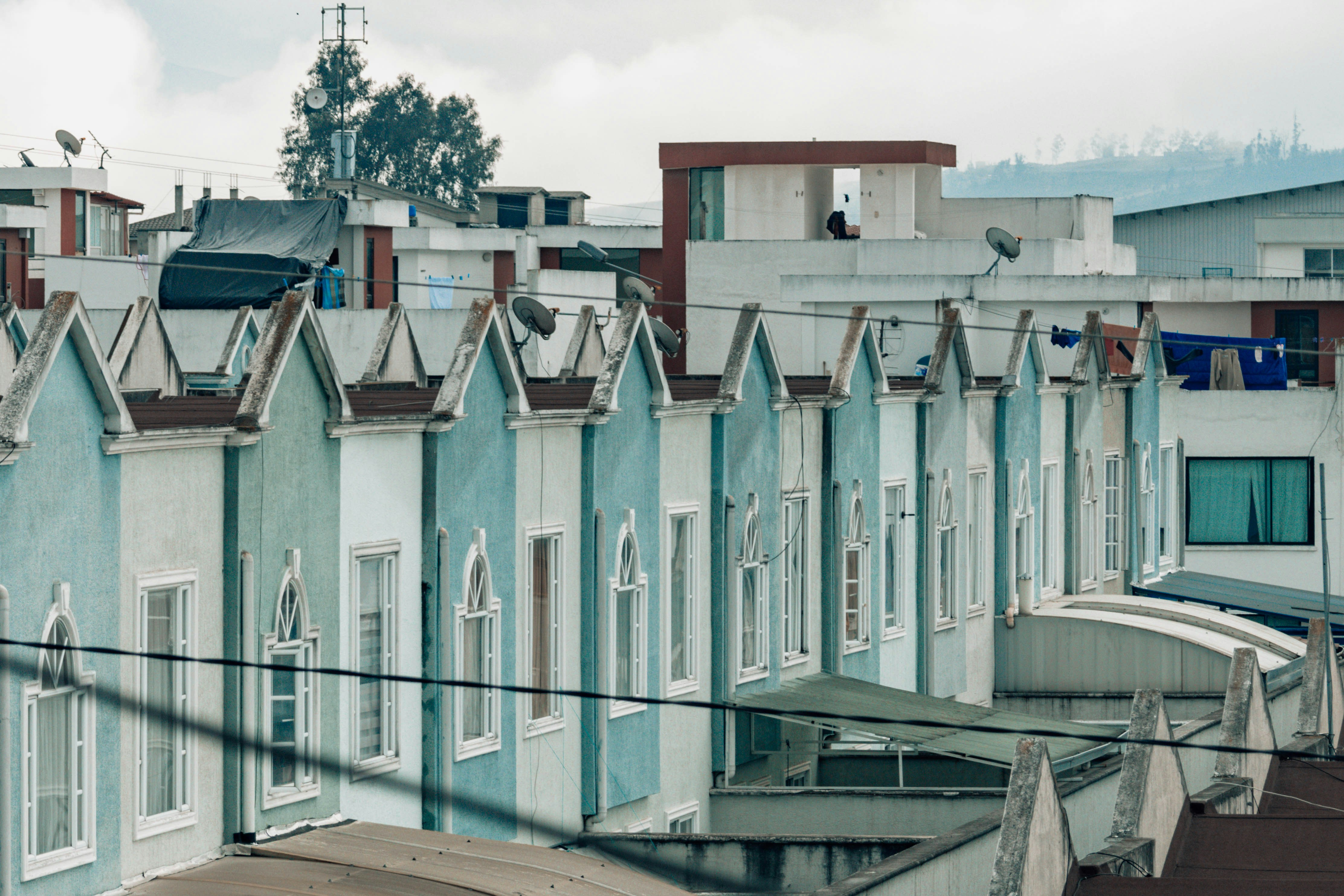 a row of houses with a sky background