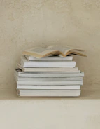a stack of books sitting on top of a table