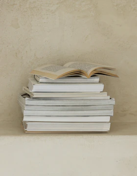 a stack of books sitting on top of a table