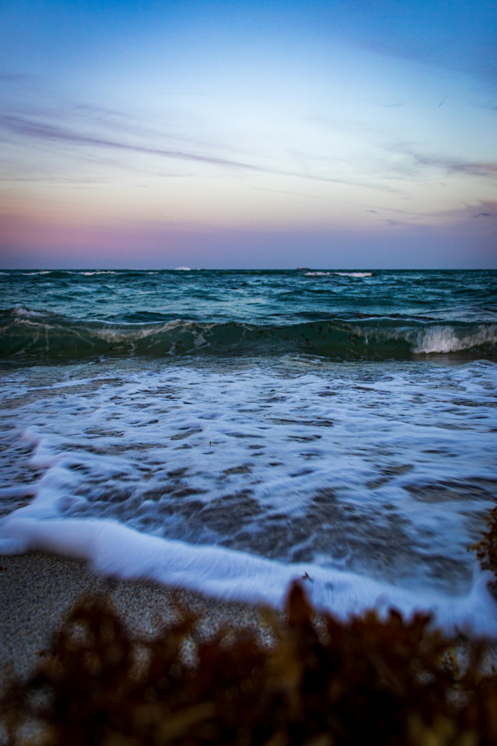 a beach with waves coming in to shore