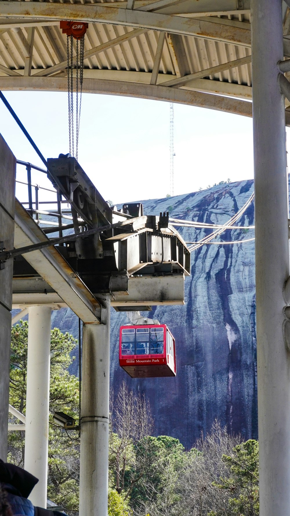 a cable car going up the side of a mountain