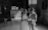 A satisfied couple reviewing documents with a financial advisor in a bright office space.