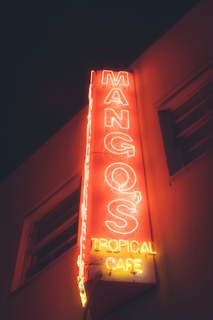 Photo of a vibrant storefront sign made by OrlandoSigns under bright Florida sunlight.