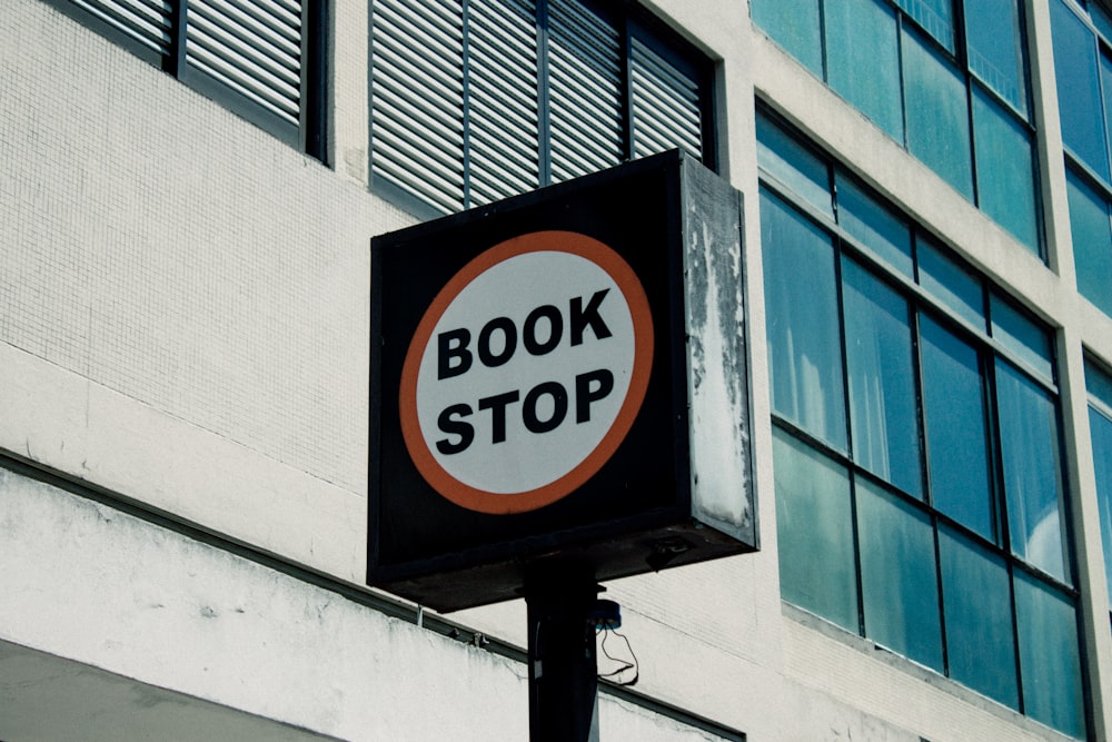 a book stop sign in front of a building
