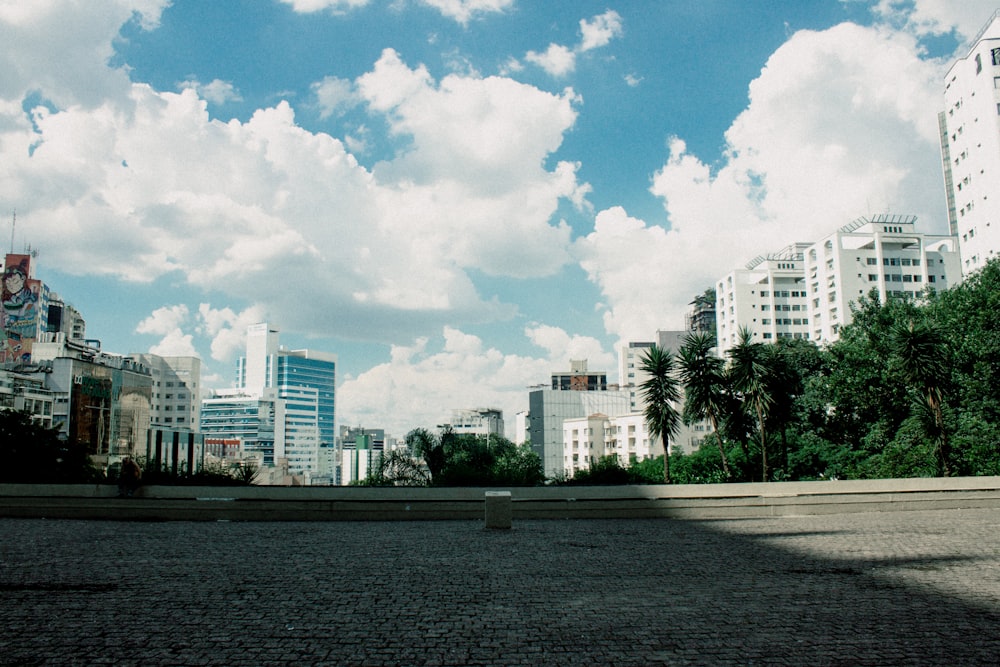 a view of a city with tall buildings in the background